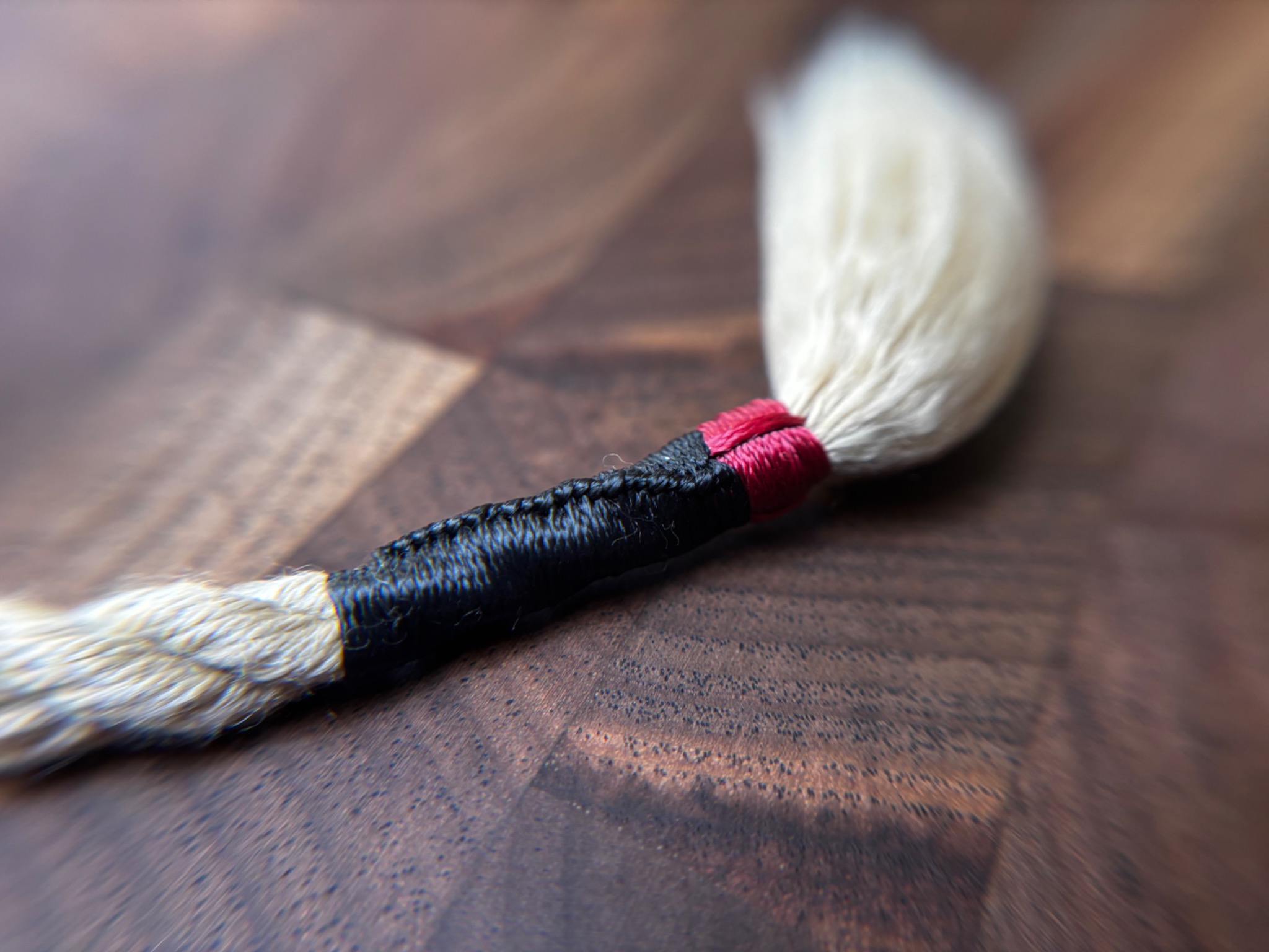 Sailmaker’s Torch finish in black and burgundy with a brushed tassel